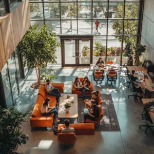 An HR professional is discussing ways to improve ratings on Glassdoor in a casual office environment.