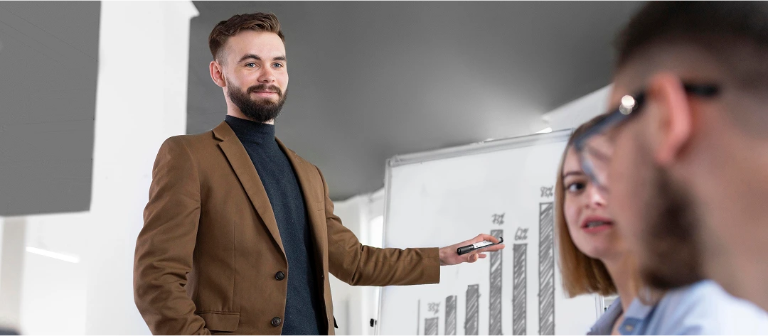 Business professional giving a presentation with a bar graph on a whiteboard, symbolizing assessment results, test performance, and workplace evaluation.