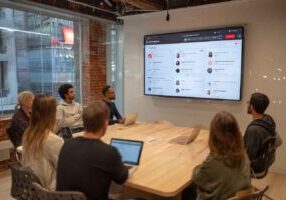 HR team reviewing AI-powered resume screening results in a meeting.