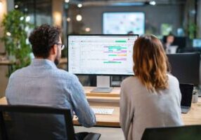 Team reviewing automated interview schedule on dashboard