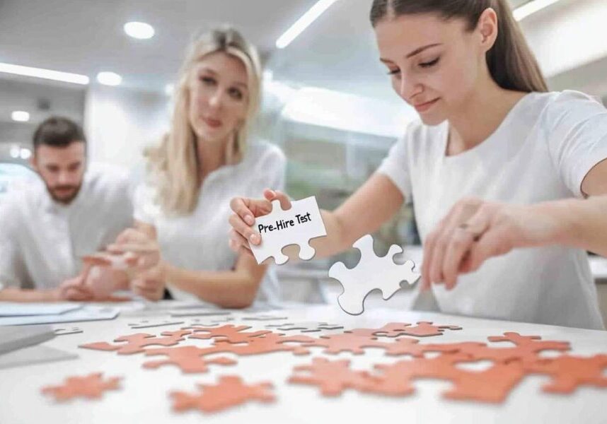 HR professional trying to fit a “Pre-Hire Test” puzzle piece into a completed team puzzle, symbolizing why pre-employment tests aren’t suited for existing employees.