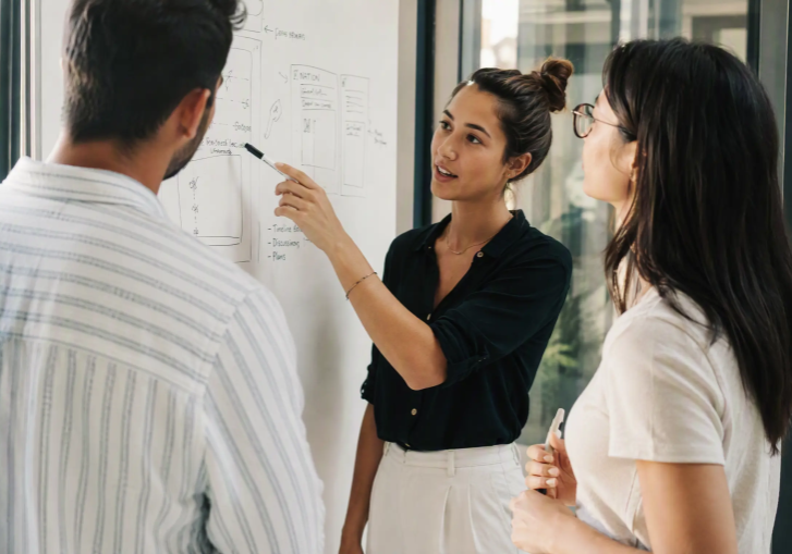 HR professional reviewing a referral program dashboard, representing Discovered's automation tools